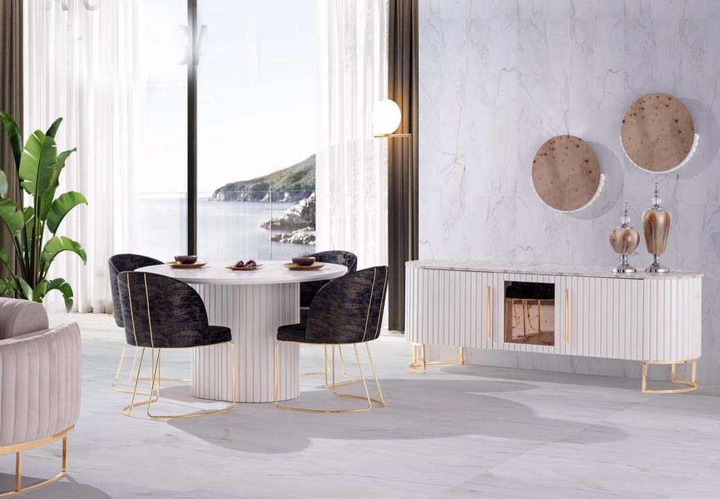 his set seamlessly melds the charm of a distinct form and the authenticity of natural textures. This striking table features a round tabletop made from real marble. The panelled wooden pedestal bas